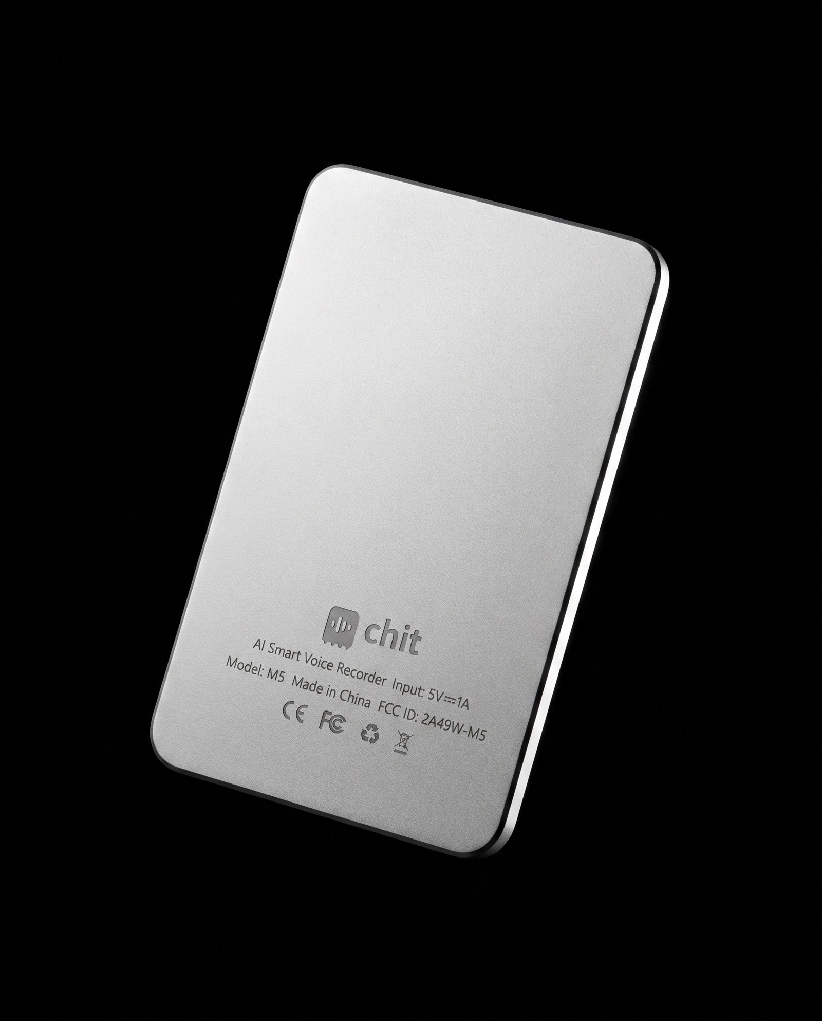 The back of chit one — bead-blasted silver with the chit mark and the regulatory engraving, CE and FCC marked.